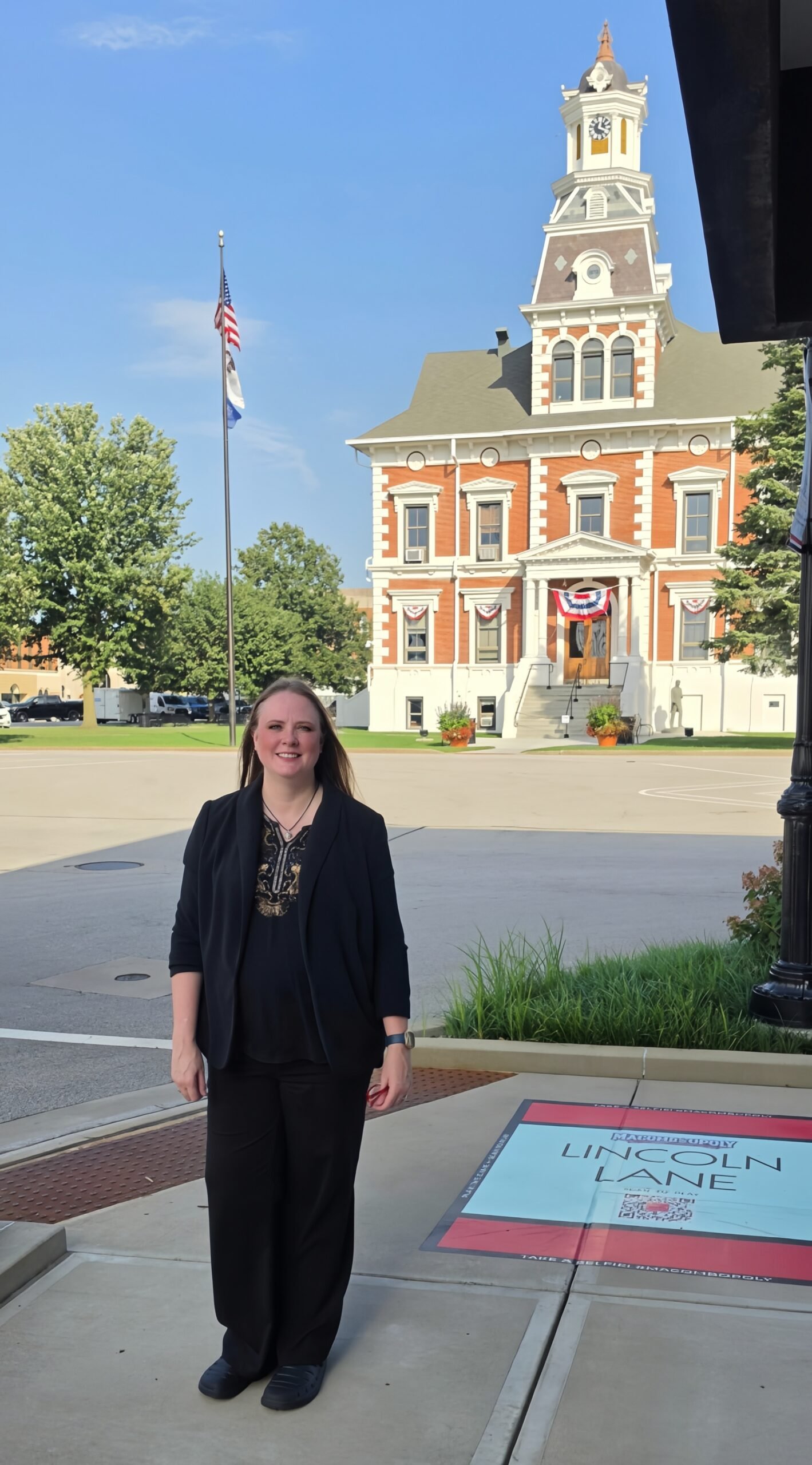 AJ Alveshere in front of the McDonough County Courthouse